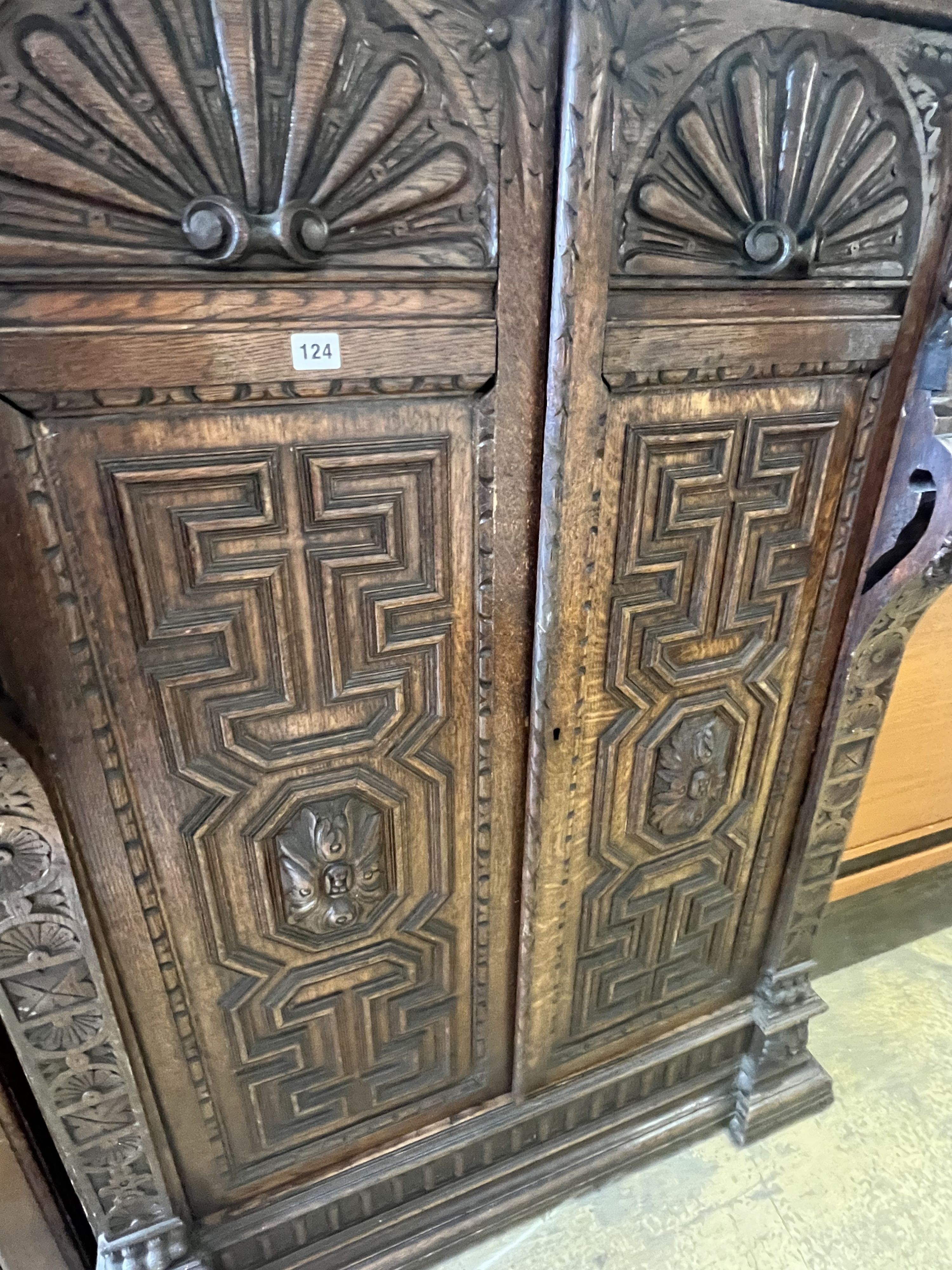 A Jacobean revival carved oak press cupboard, width 115cm depth 63cm height 156cm